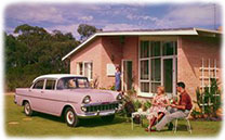 1960s front yard with car and people